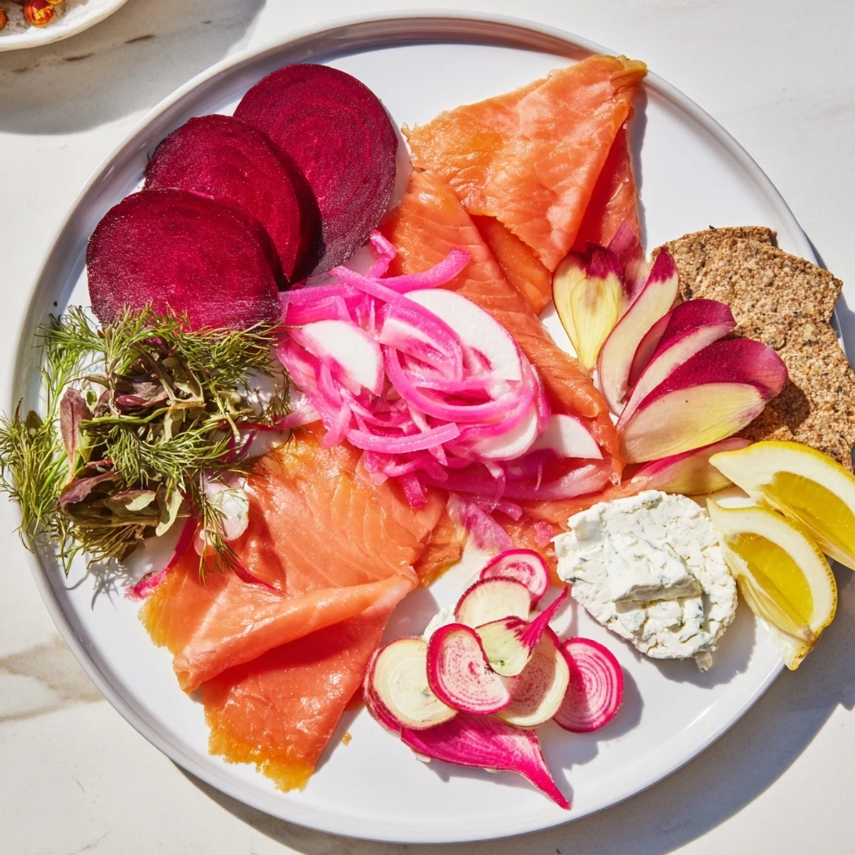 Vibrant Winter Harvest Smoked Salmon Board, brimming with textures from salmon, roasted beets, and crusty bread.