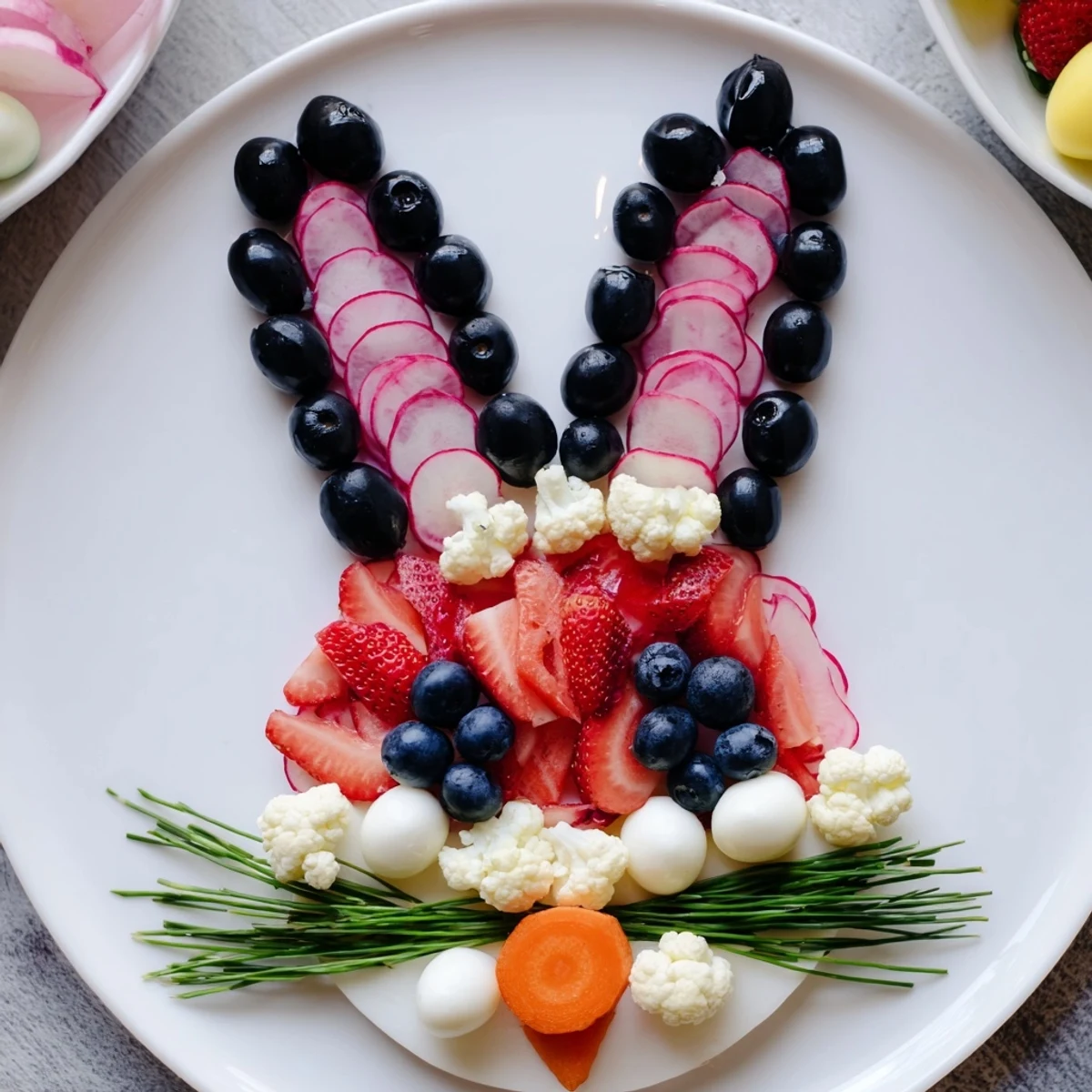 Festive Bunny Silhouette appetizer: a colorful platter filled with fresh fruits and creamy cheeses.