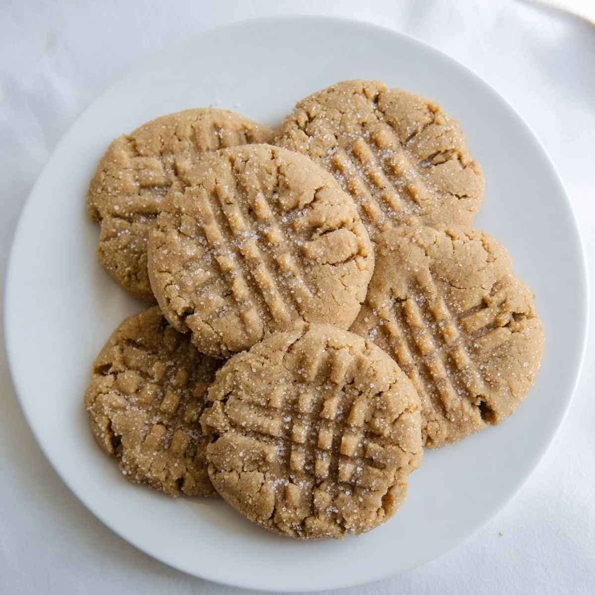 Golden-brown flourless peanut butter cookies, a delightful gluten-free dessert ready to enjoy.