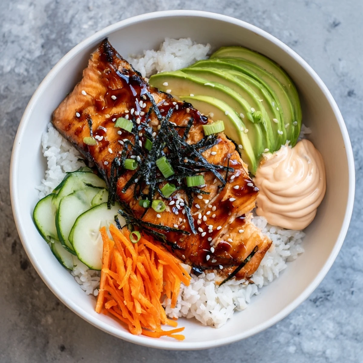 Image of a beautifully plated teriyaki salmon rice bowl with vibrant, glazed salmon and fresh veggies.