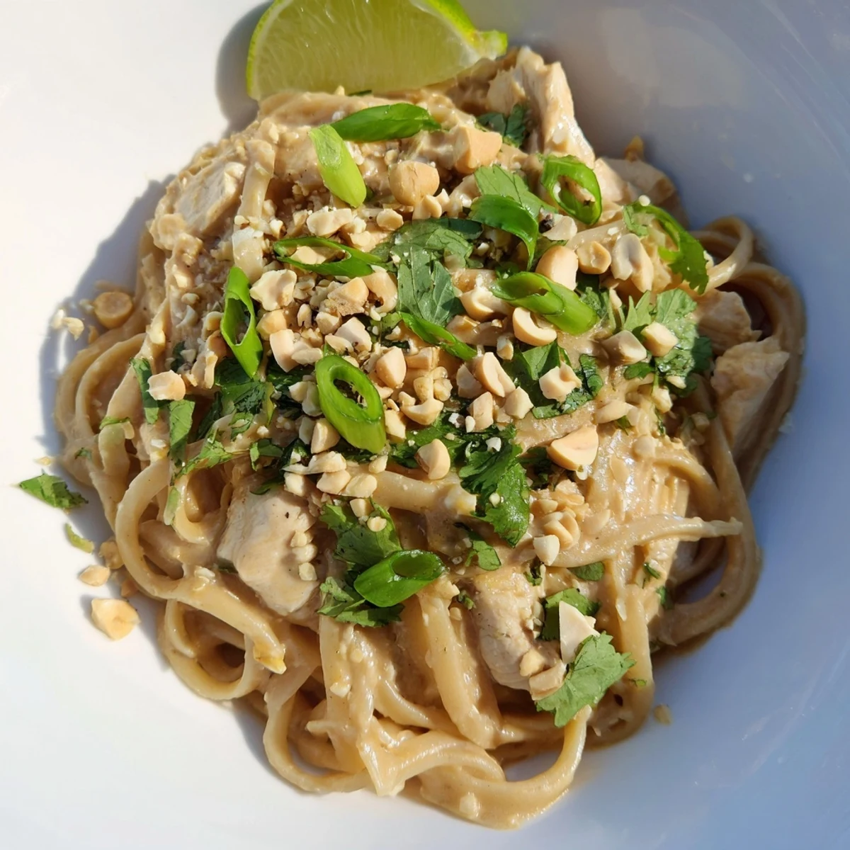 Tender chicken and linguine coated in creamy peanut sauce, a delicious Thai Peanut Chicken Pasta.