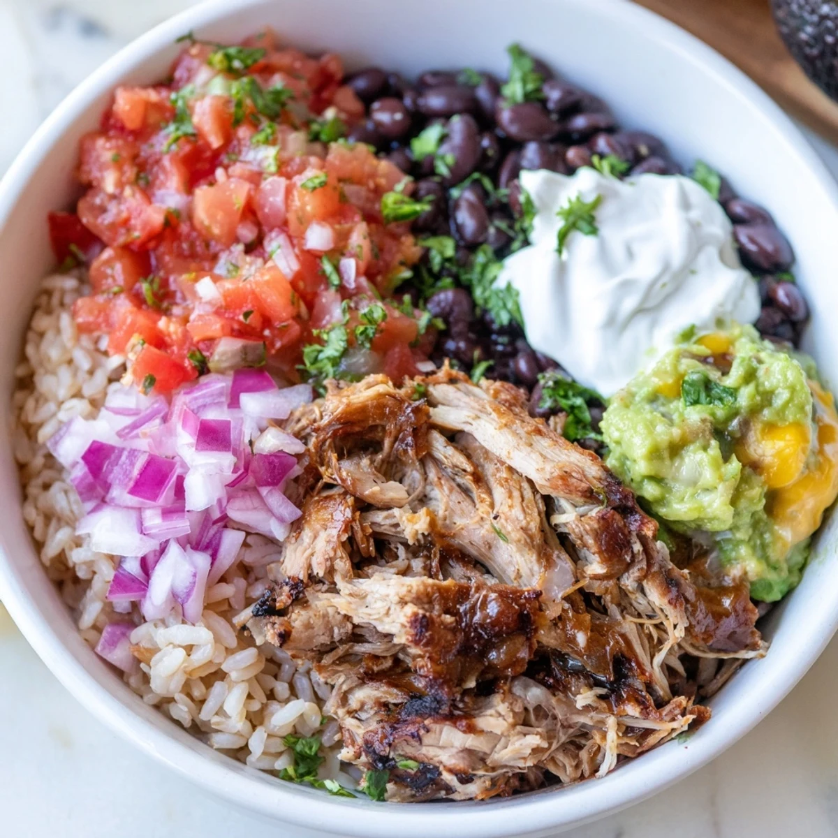 This impressive Chipotle Burrito Bowl copycat features layers of vibrant, fresh, and delicious ingredients.