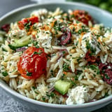 Juicy tomatoes and feta adorn this delicious Summer Orzo Salad with Lemon.