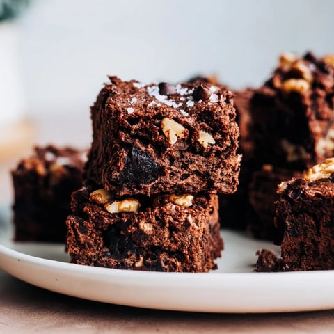 Fudgy sweet potato brownies, topped with rich chocolate chips, ready to slice and serve.