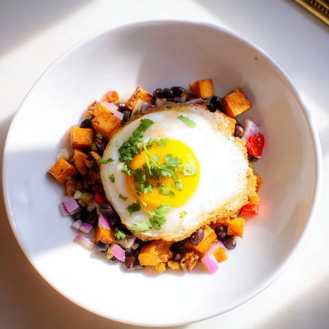 Golden, roasted sweet potatoes and black beans in this delicious breakfast hash with eggs.