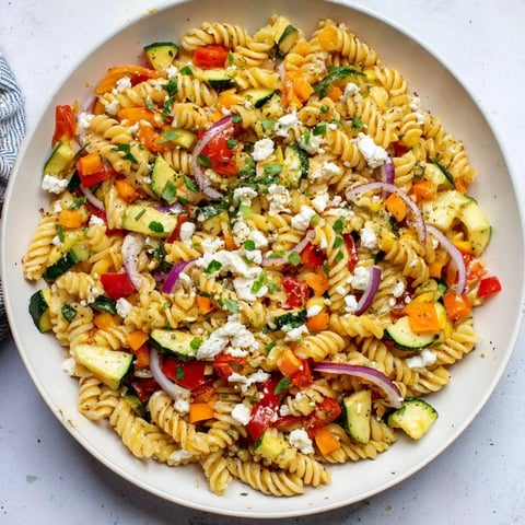 Pasta Salad with Seasonal Veggies & Simple Dressing, with colorful veggies and creamy dressing, perfect picnic food.