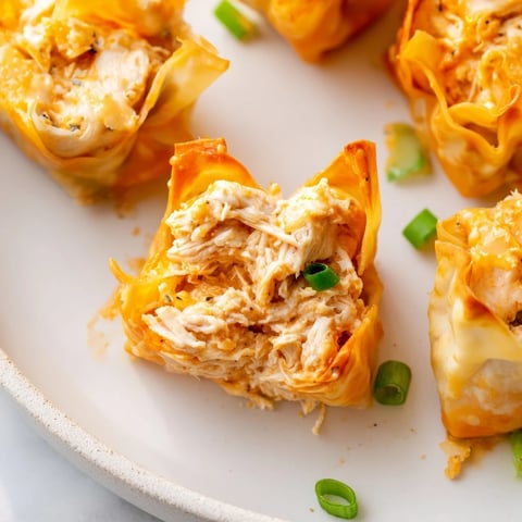 Golden, crispy Buffalo Chicken Dip Pinwheel Wonton appetizers, perfect for game day snacking and parties.