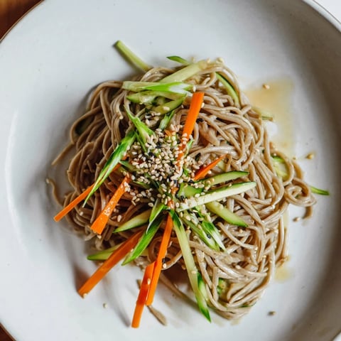Cooling and colorful chilled noodle lunch cups, filled with fresh vegetables, perfect for a picnic.