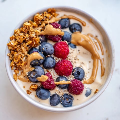 A close-up of creamy, homemade protein ice cream bowls, ready for topping and enjoying.