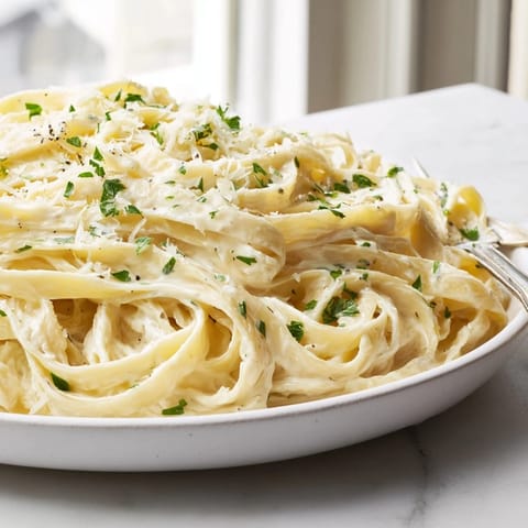 Savory One-Pot Garlic Parmesan Pasta, ready in just thirty minutes for busy families.  
