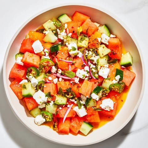 A close-up shot of a refreshing Cucumber and Watermelon Hot Girl Salad, ready for a summer meal.
