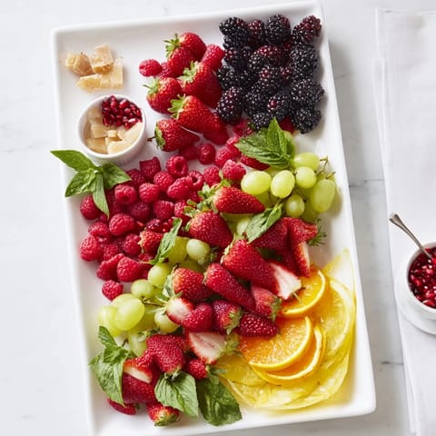 A beautifully arranged Bubbly Bar Garnish Platter featuring colorful fruits ready for a New Year's Eve celebration.