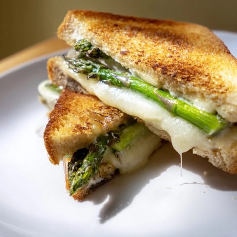 Toasted golden-brown, the asparagus Brie grilled cheese oozes melted cheese and tender green spears.  