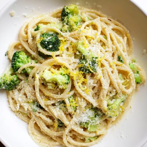 In a pot, al dente spaghetti tosses with broccoli and creamy garlic sauce for this one-pot lemon broccoli pasta.  