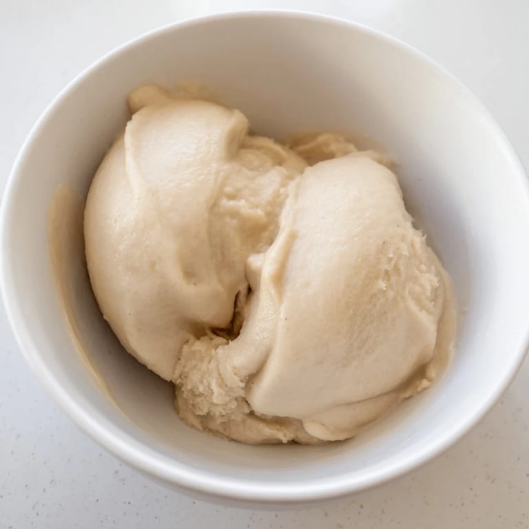 Smooth 2-Ingredient Banana Ice Cream, perfectly frozen and blended until achieving a delightful soft-serve texture.