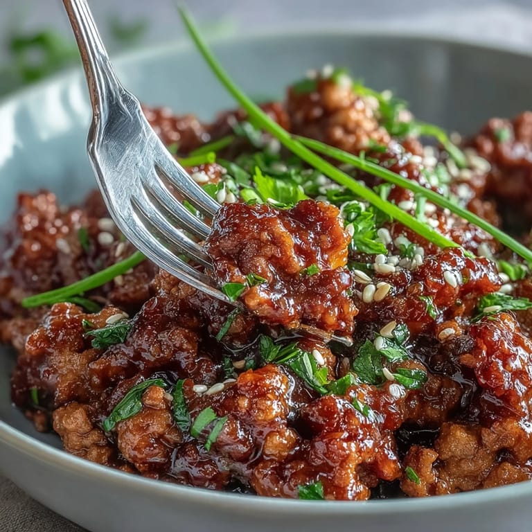 Fragrant Korean-Style Ground Turkey in a skillet, flecked with chives, ready to be scooped over warm rice.
