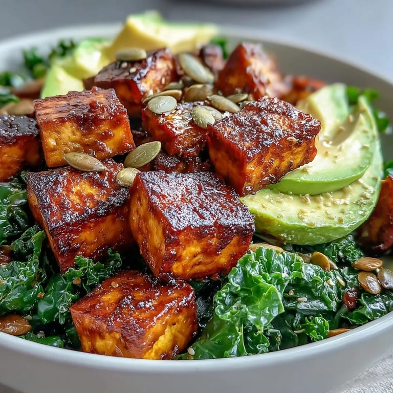 Wholesome tofu scramble with turmeric and paprika, served over tender kale and topped with fresh avocado and green onions.  