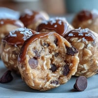 Creamy peanut butter energy balls studded with rich dark chocolate chips and wholesome oats for a satisfying snack.  